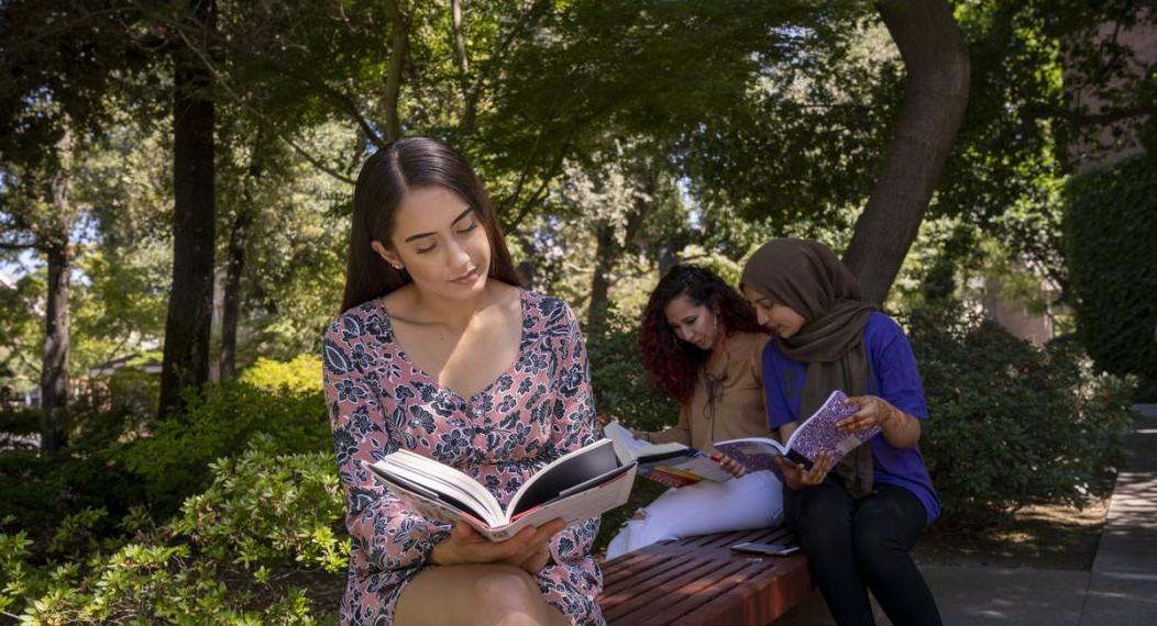 Sociology students Catalina Vasquez, right, with Brianna Rojas, center, and Rahila Shah