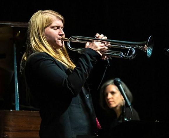 Kate Williams playing her trumpet 